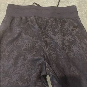 Nike Black and Blue Track Pants with Textured Design